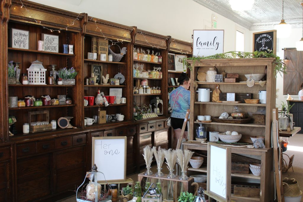 Score Fun Here: Image of a boutique with ceramics and household goods on shelves.