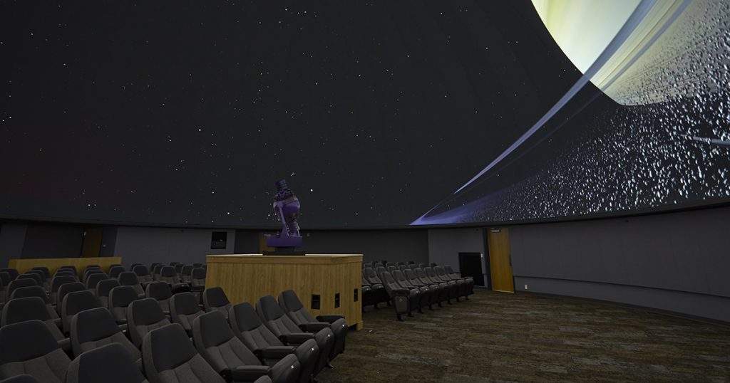 Plan a kid-friendly family vacation by taking in a free planetarium show.